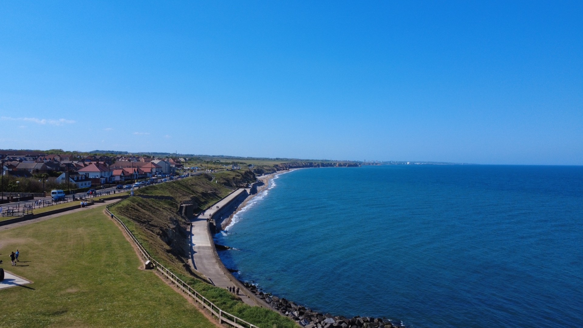 Aerial view looking north along the Seaham coastline, town and cliffs